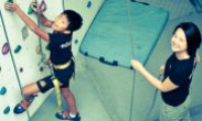 Tutor Yuet Ling in a holistic holiday outing with eduKate students and parents teaching forces and gravity using wall climbing facilities