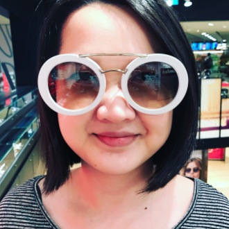 The Devil wears Prada, Yuet Ling trying on crazy sunnies just for fun.